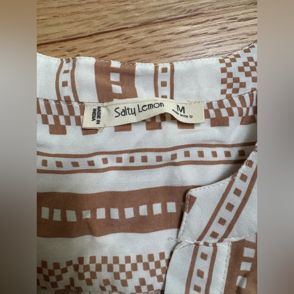 Boho tunic dress features a brown and white geometric pattern with tiered skirt - Picture 3 of 6